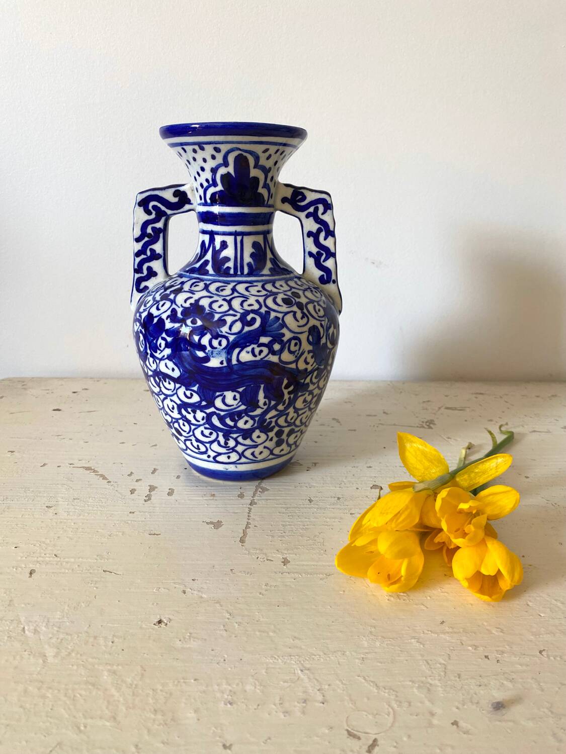 Small amphora vase in old hand-painted ceramic