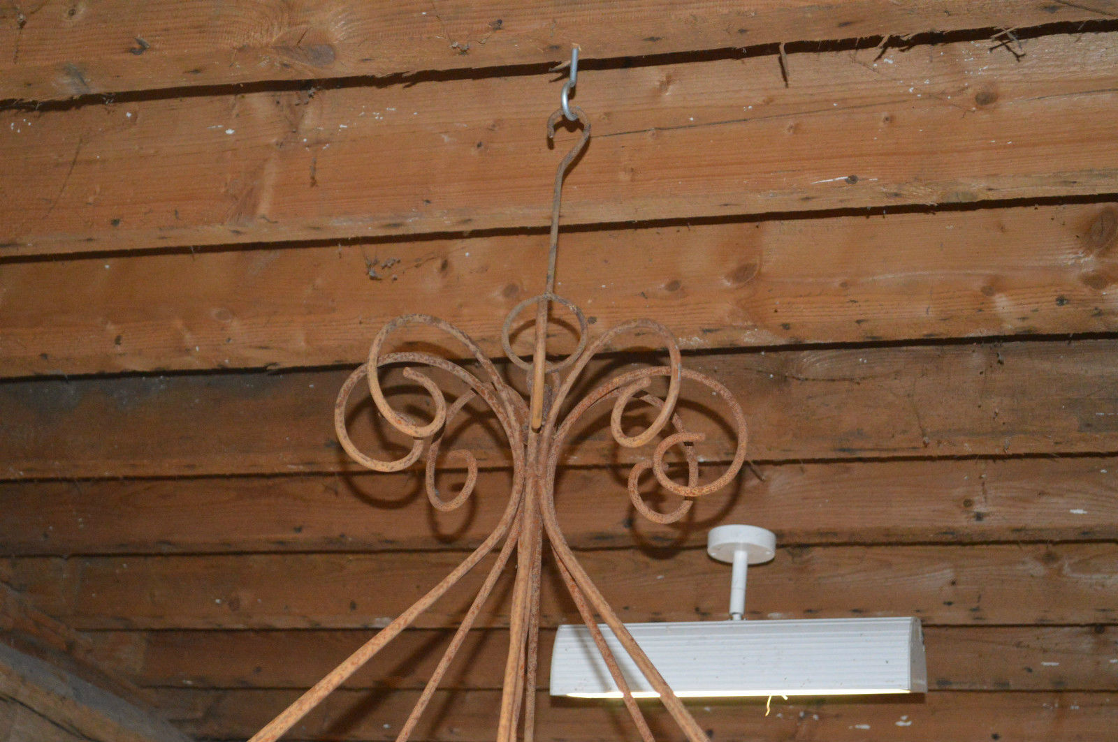 A wrought iron candle chandelier / 118 cms in diameter