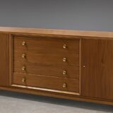 According to André Arbus, a sideboard in a row from the Art Deco period in blonde mahogany.