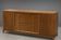 According to André Arbus, a sideboard in a row from the Art Deco period in blonde mahogany.