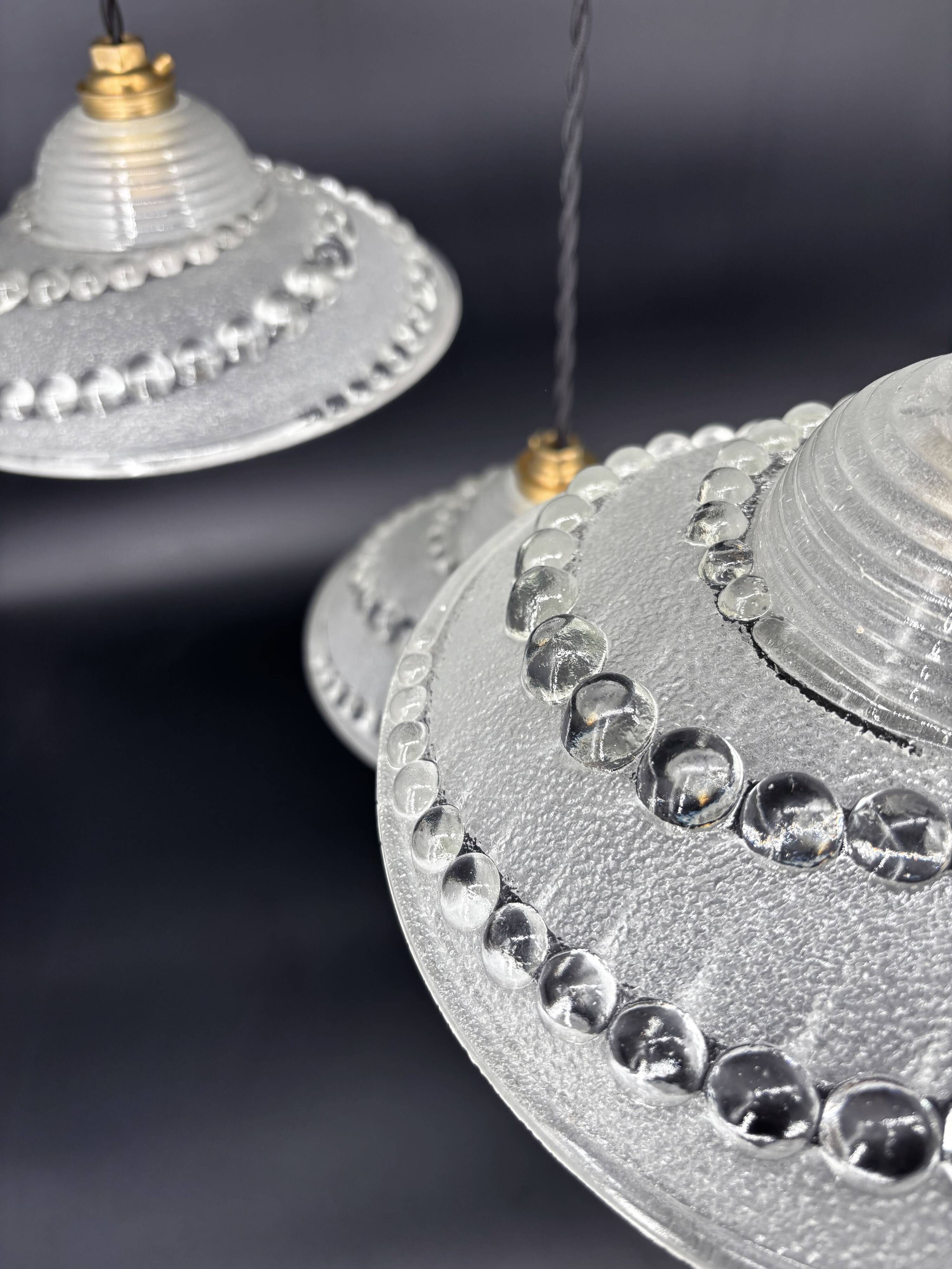 Set of 3 moulded glass pendant lights with cabochons, Art Deco style Ezan.