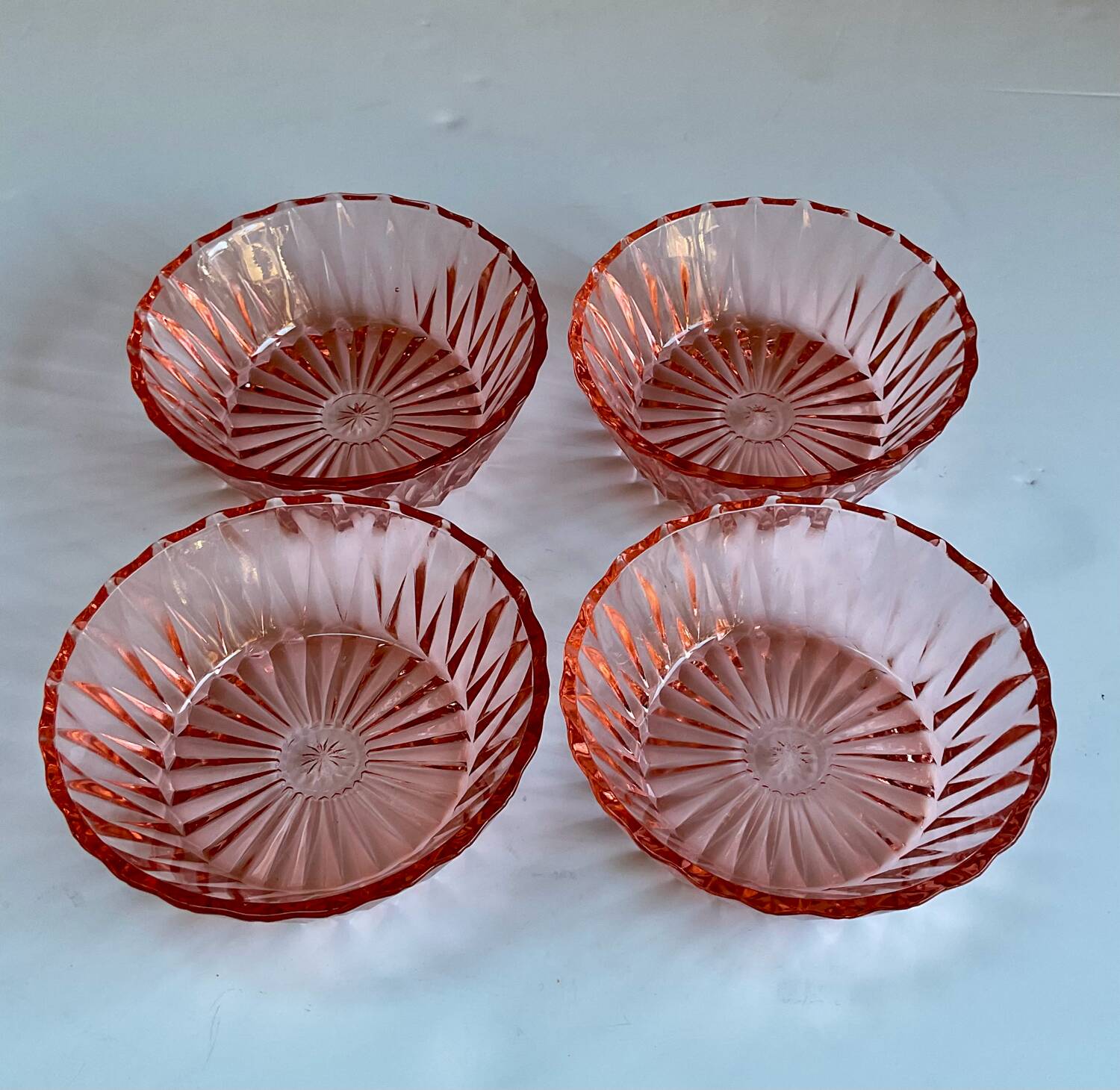 4 pink glass bowls