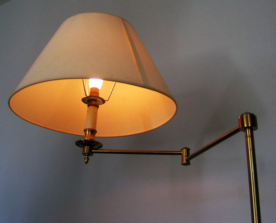 Articulated brass floor lamp