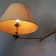 Articulated brass floor lamp