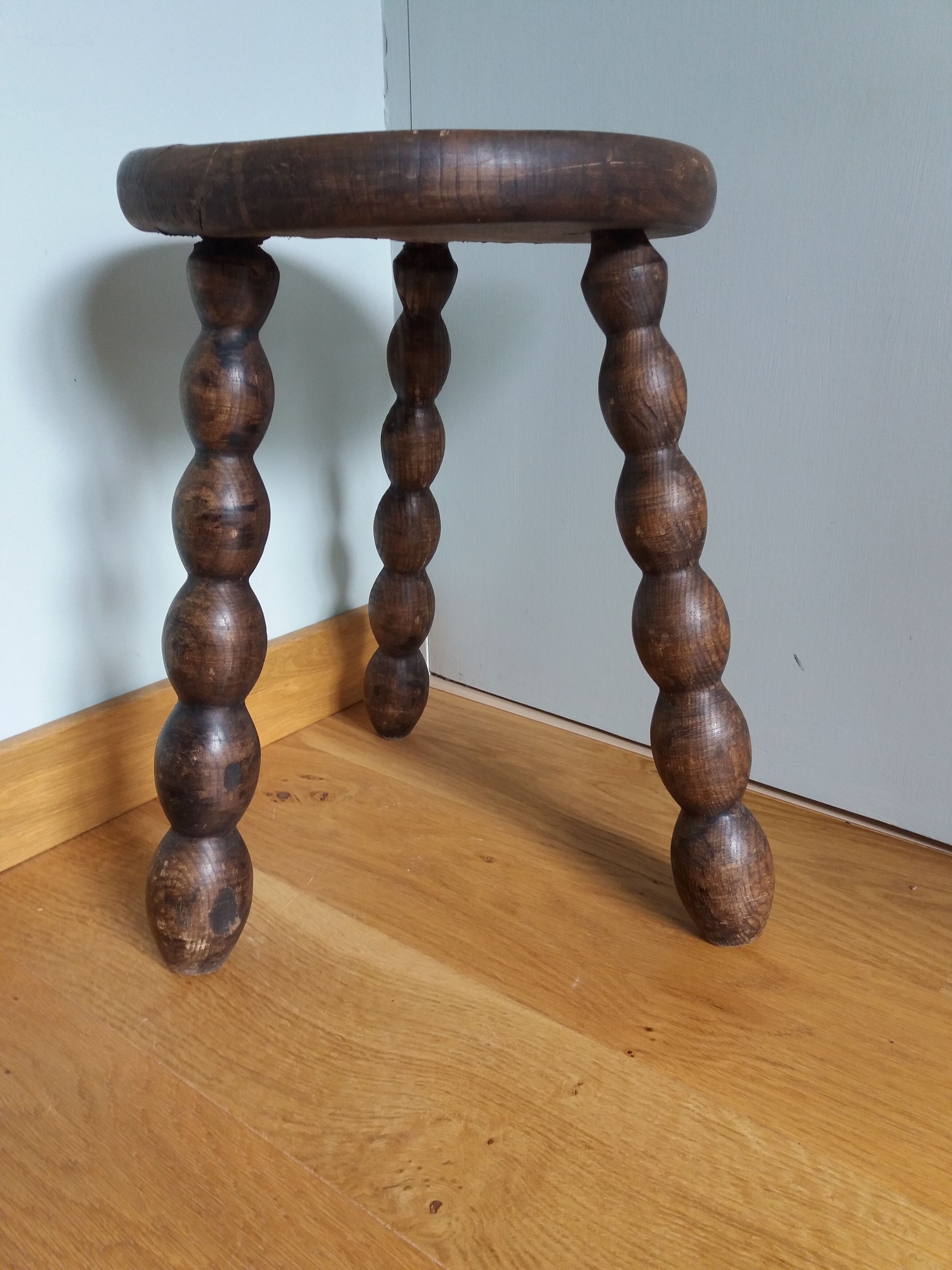Tripod stool in wood turned coil way