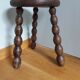 Tripod stool in wood turned coil way