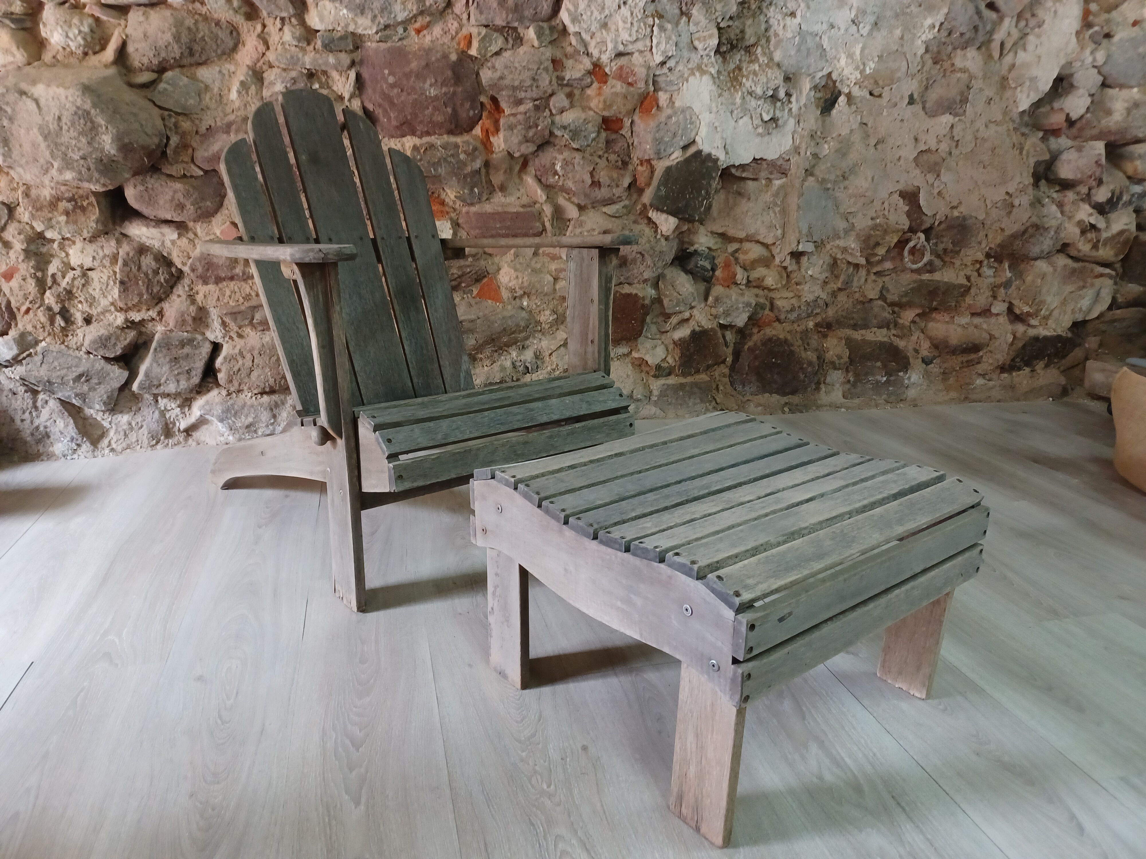 Ancient Adirondack armchair with footrest