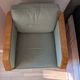 Vintage armchair Hugues Chevalier Paris — Almond green leather & Wood