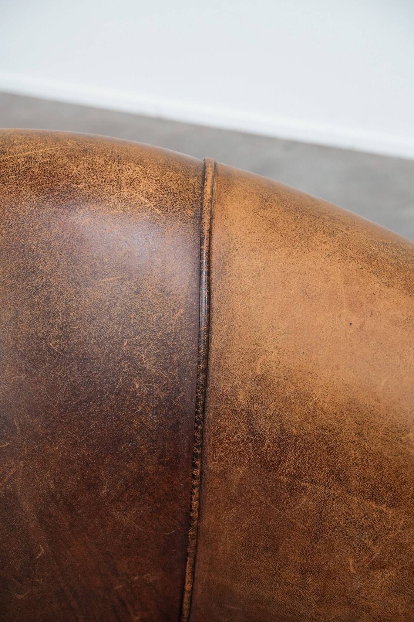 Vintage club chair in sheepskin leather with a characterful look