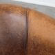 Vintage club chair in sheepskin leather with a characterful look