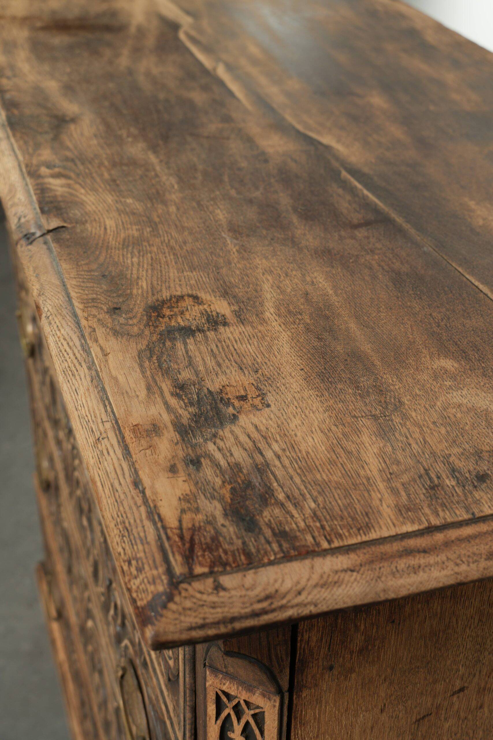 Richly carved English oak chest of drawers from the 18th century