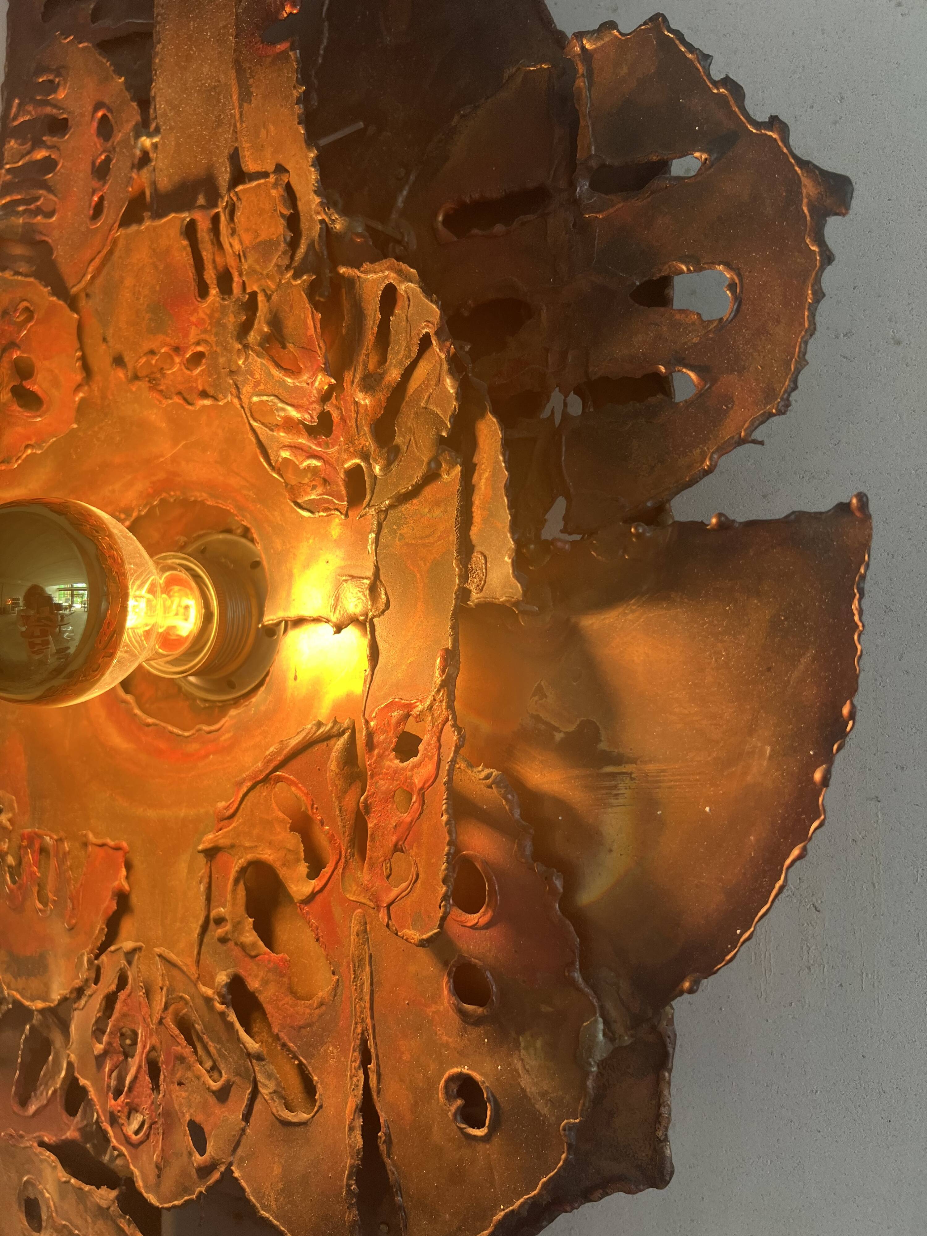 Raw expressive wall sconces by Francesco Pasinato