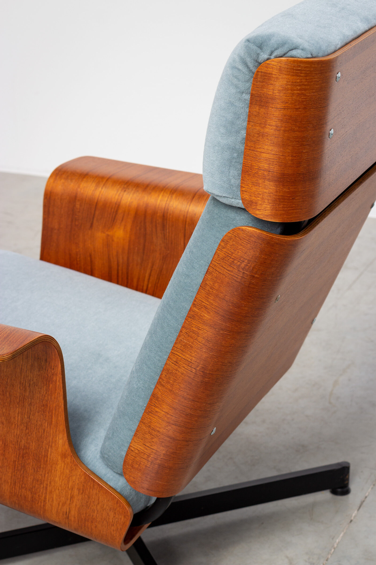 Pair of modernist teak lounge chairs and poufs 1960