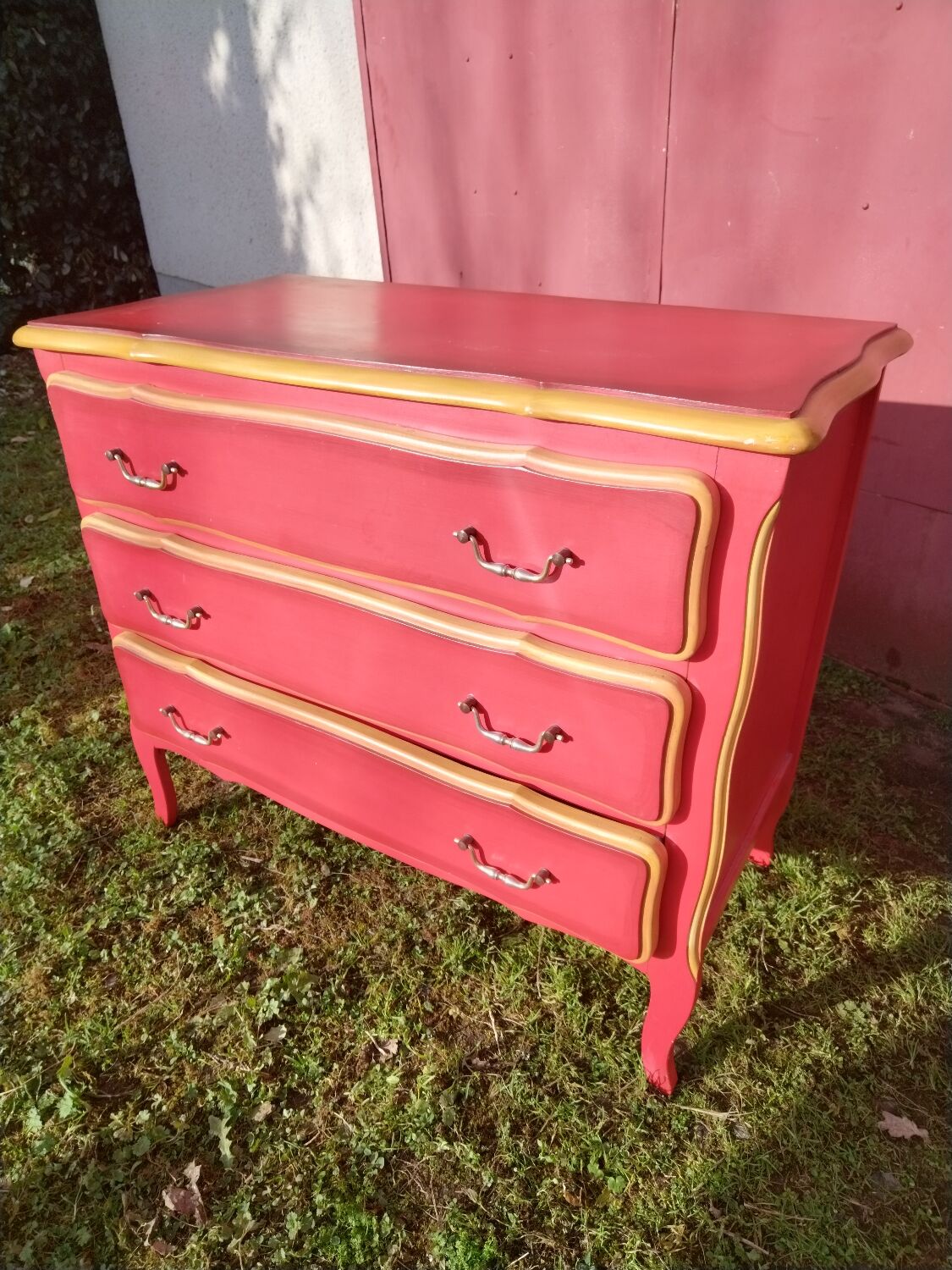 Matte gold and red patinated chest of drawers