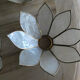 Brass chandelier and flowers in mother-of-pearl petals