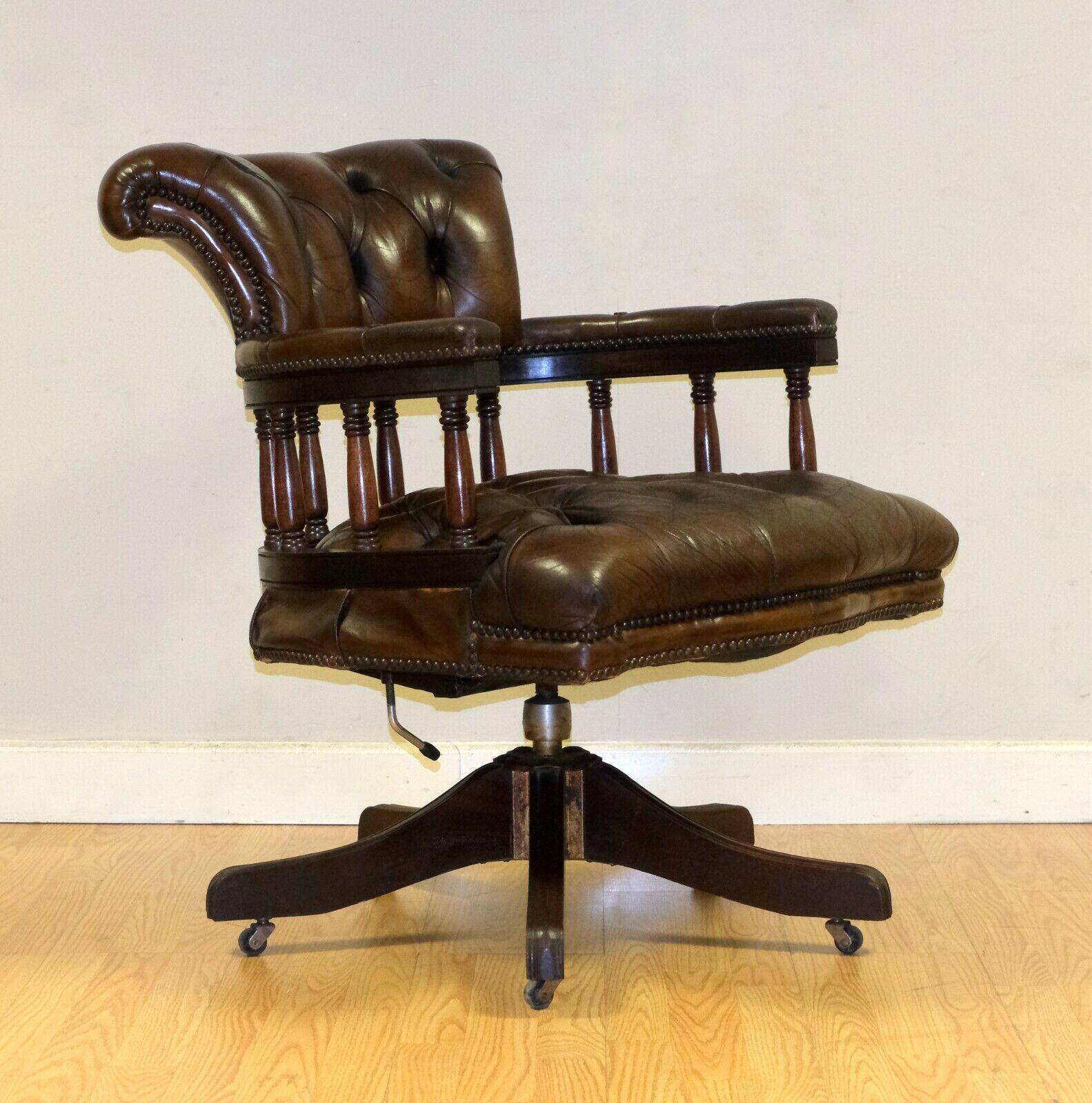 Restored Chesterfield captain's armchair in leather with an oak frame.