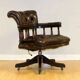 Restored Chesterfield captain's armchair in leather with an oak frame.