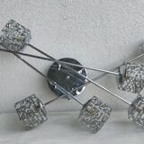 Articulated chromed metal luminaire