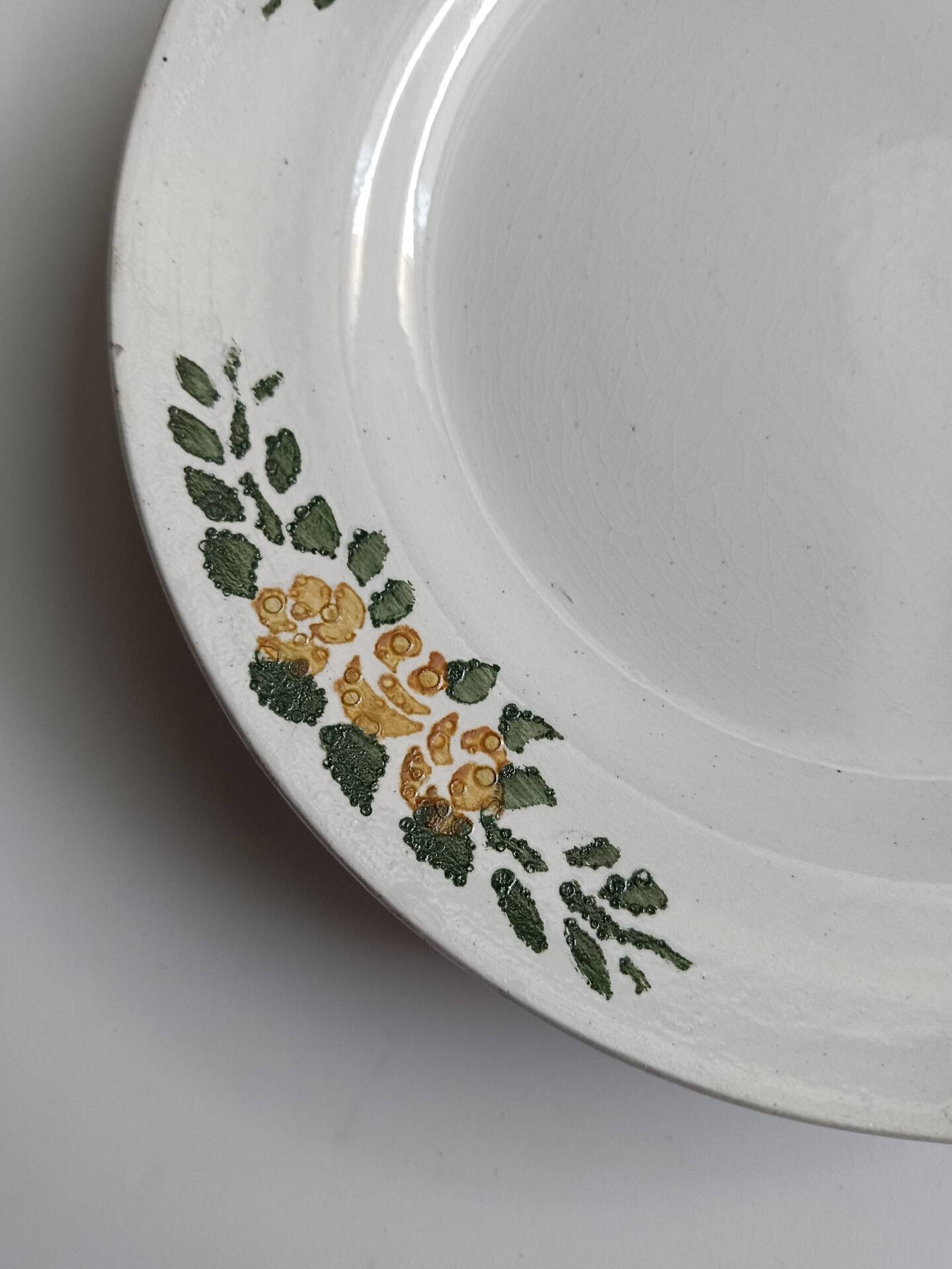 Old round footed plate signed Labrut brothers flowers