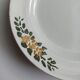 Old round footed plate signed Labrut brothers flowers