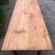 Antique Louis Philippe style farm table in solid cherry wood with 2 drawers and turned base.