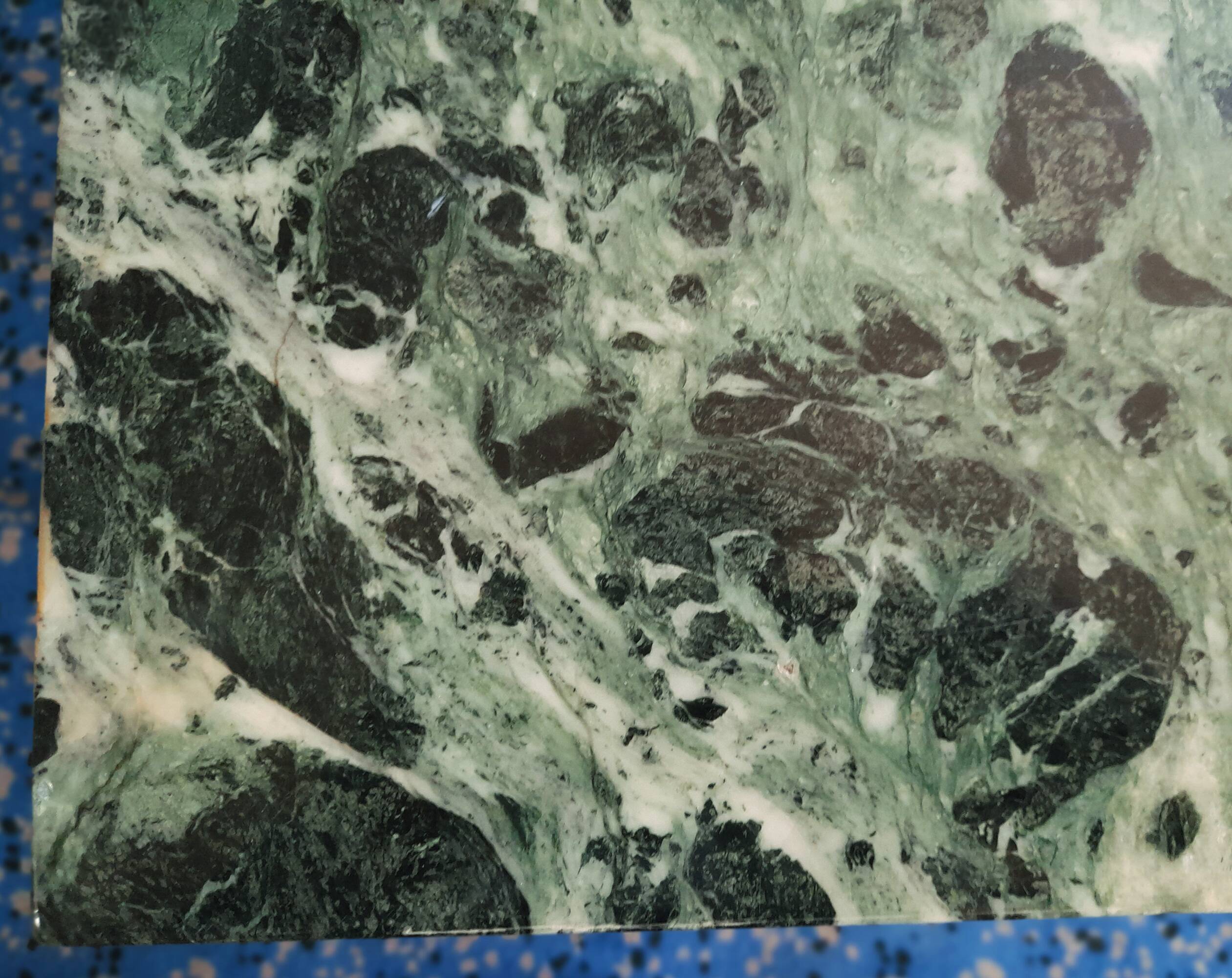 Coffee table in gilded bronze and green Alpine marble