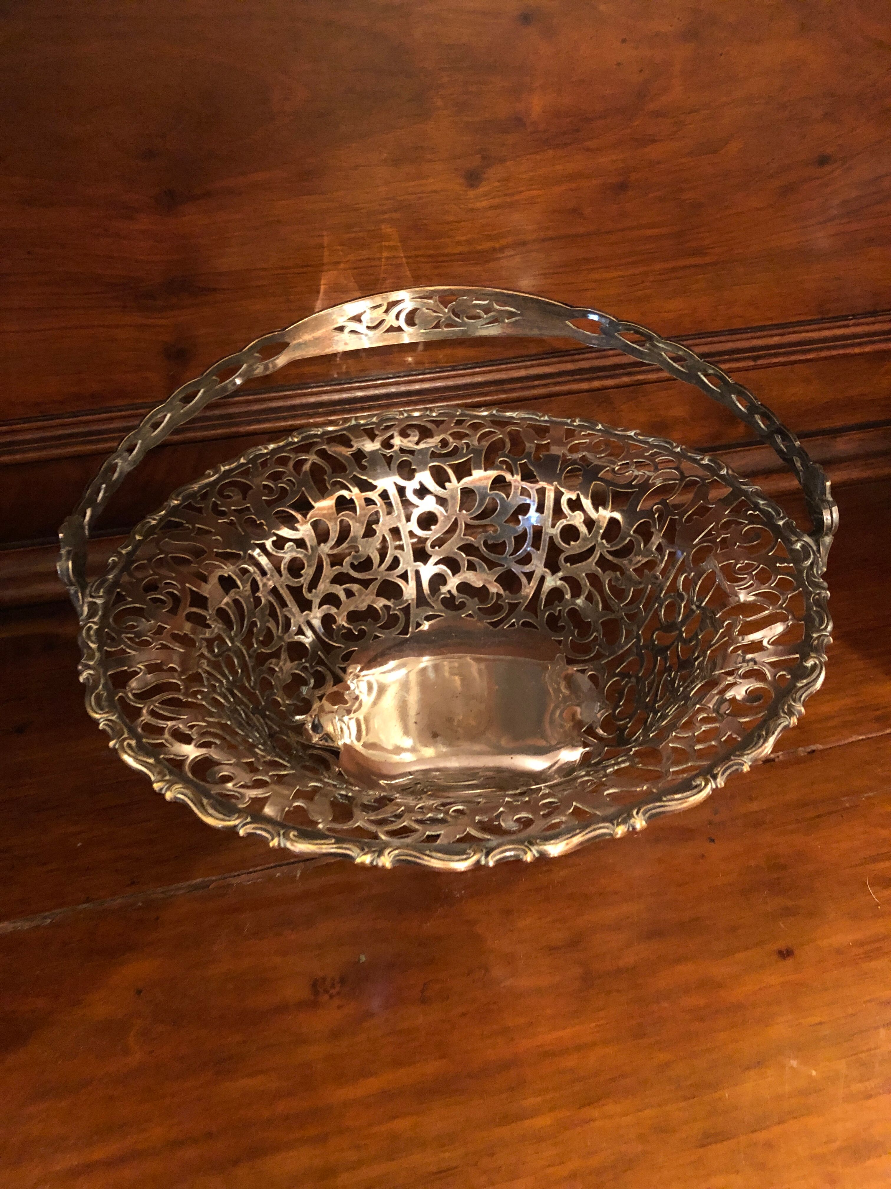 Open silver metal fruit basket