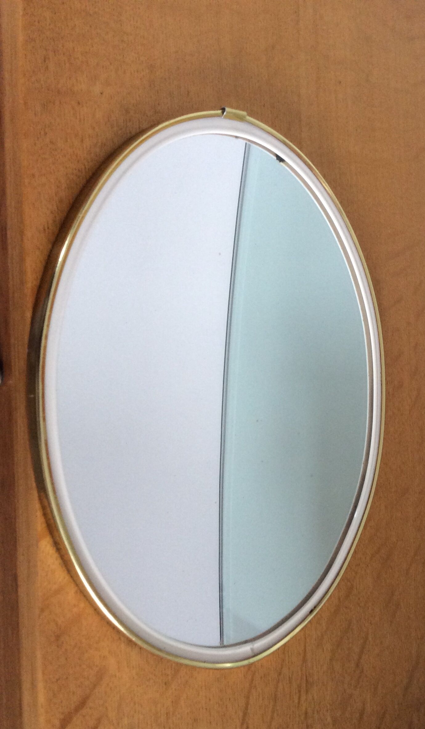 Free-form oval sheathed mirror from the 60s and 70s