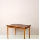 Scandinavian table with sliding panels.
