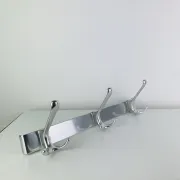Wall-mounted coat rack, strip of 3 aluminium hooks from the 1960s.