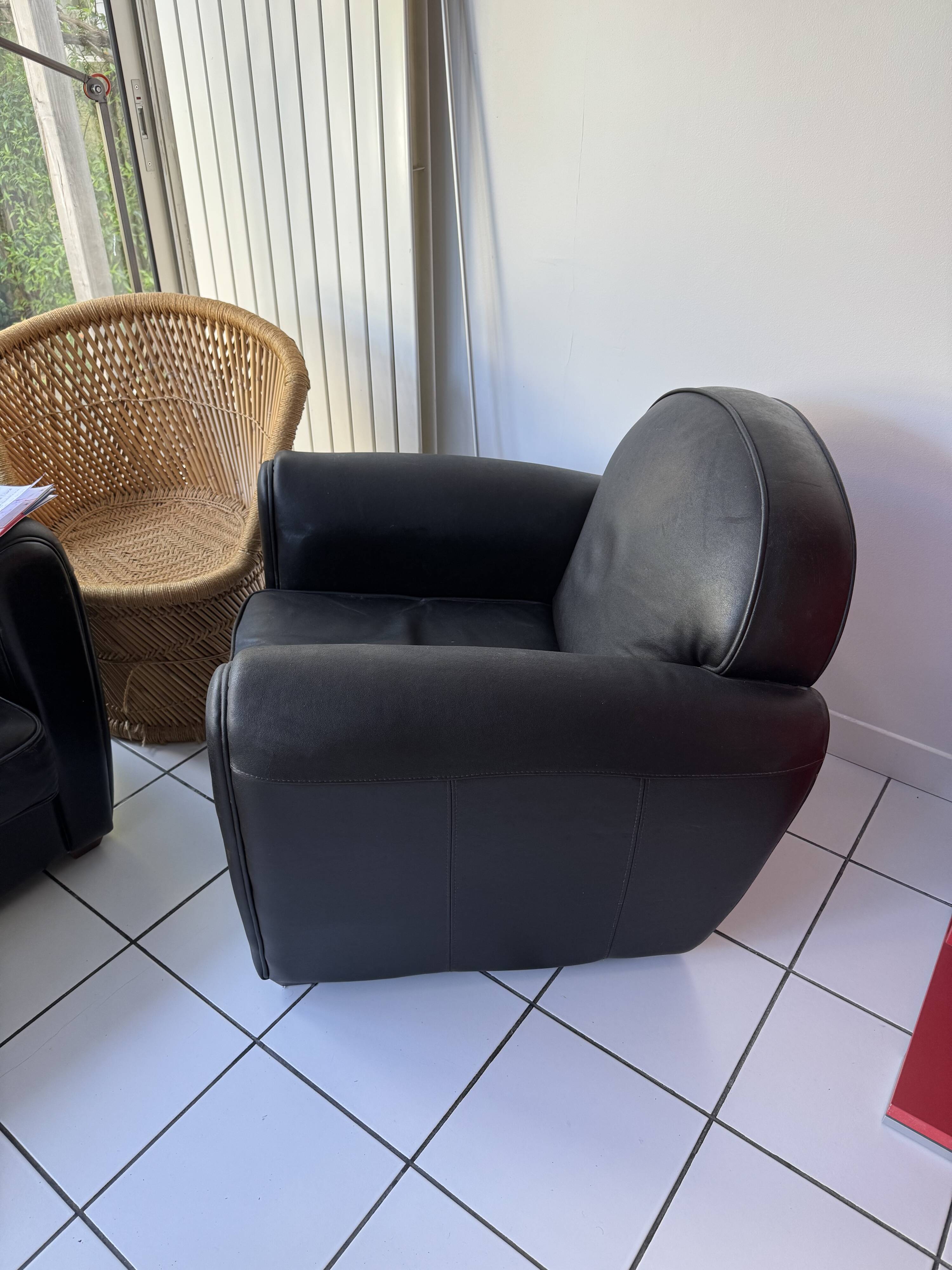 Matching black leather armchair – comfort and elegance