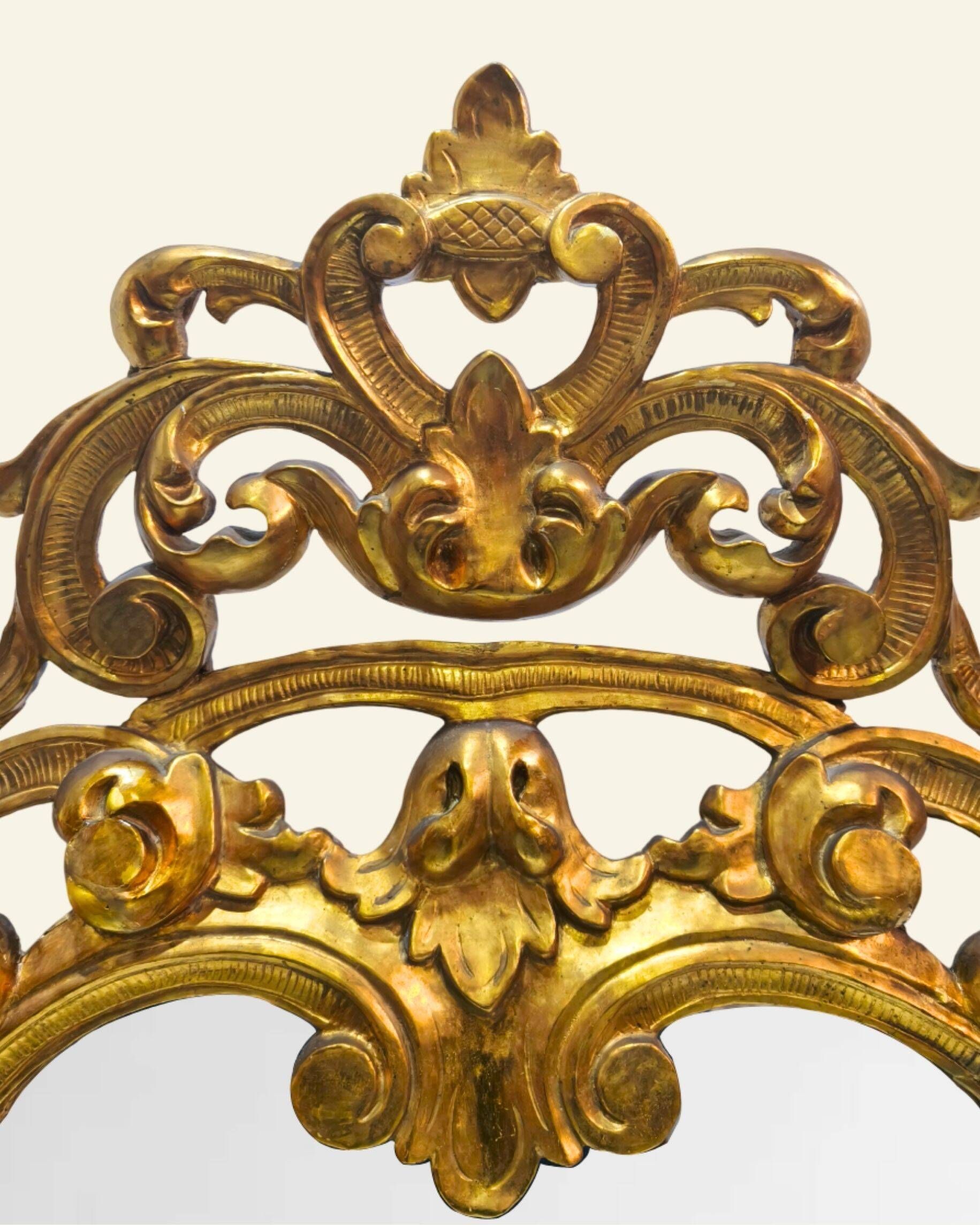 Antique wall mirror in carved and gilded wood, baroque style, 140 × 115 cm