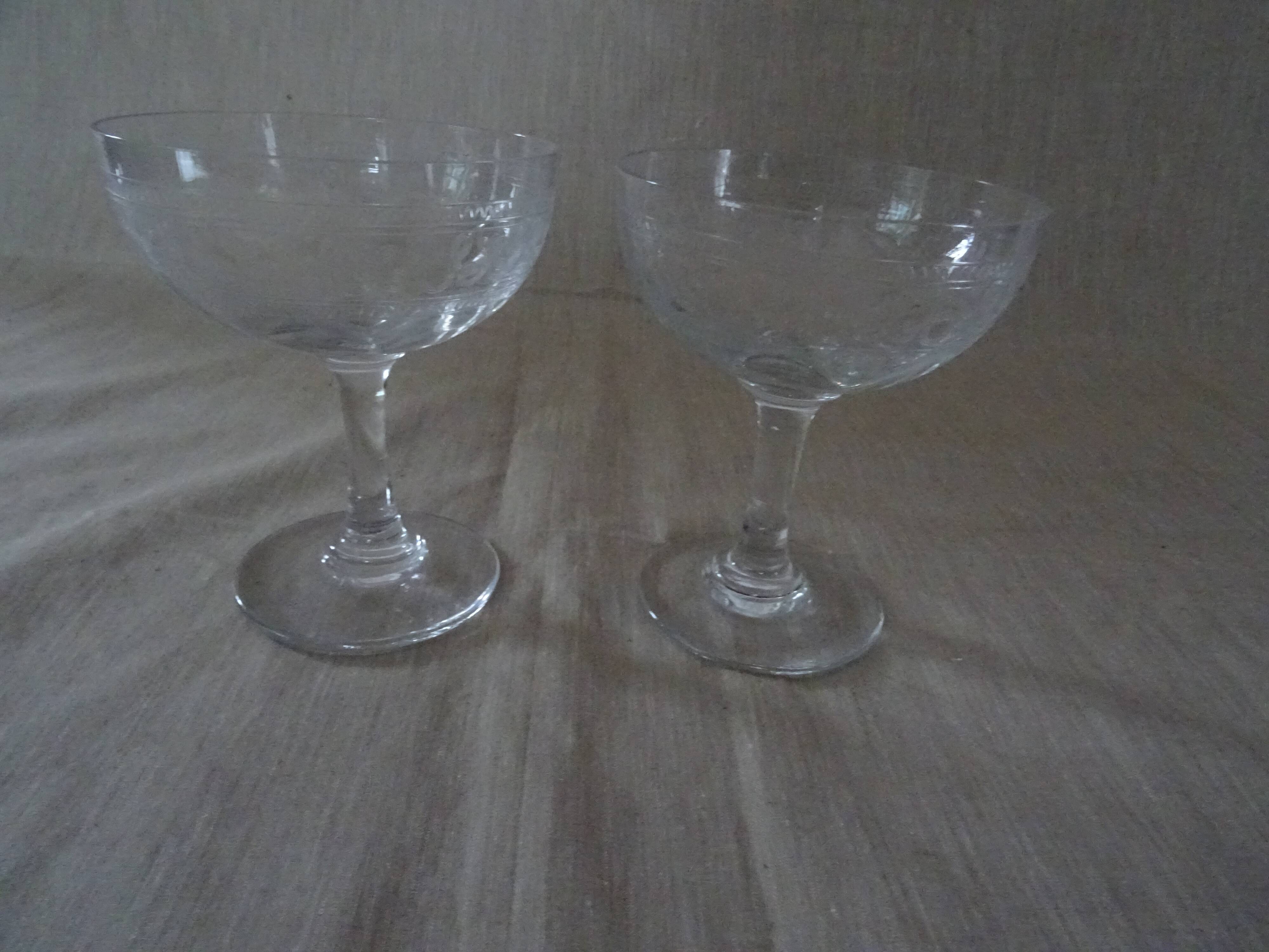 Pair of old crystal champagne glasses wide frieze right foot