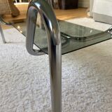Double top coffee table in smoked glass and tubular structure in chromed steel