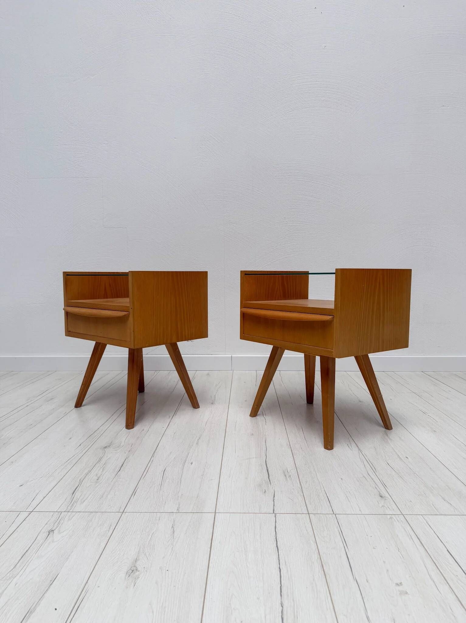1960s vintage pair of mid-century walnut nightstands with glass shelves