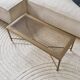 Coffee table in gold metal and glass