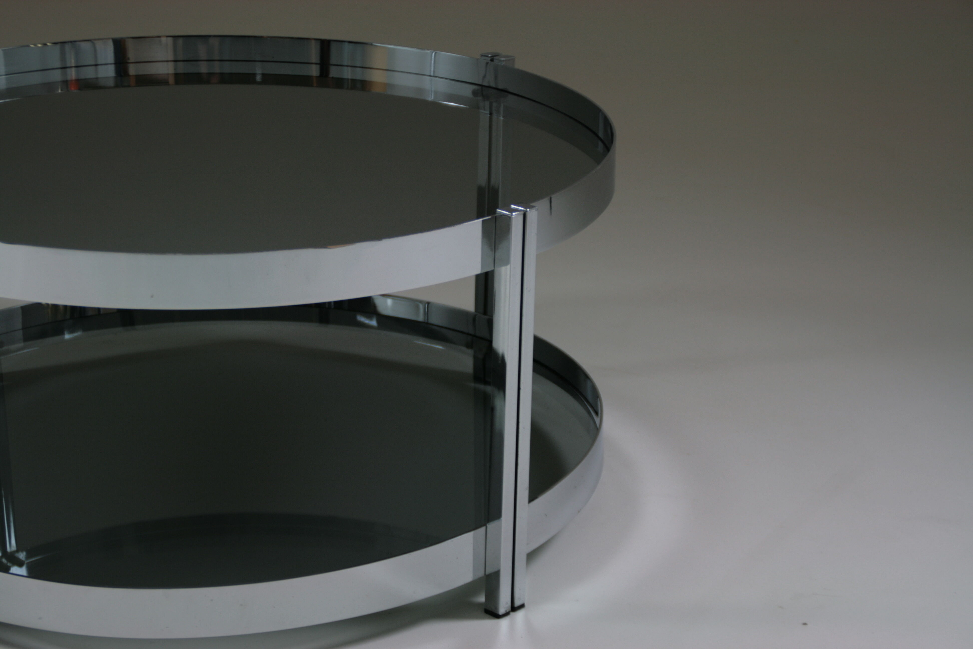 Round chrome-plated metal coffee table and smoked glass tops, France 1970s