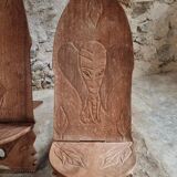 Pair of hand-carved wooden folding chairs – African origin, animal and face motifs, mid-20th century