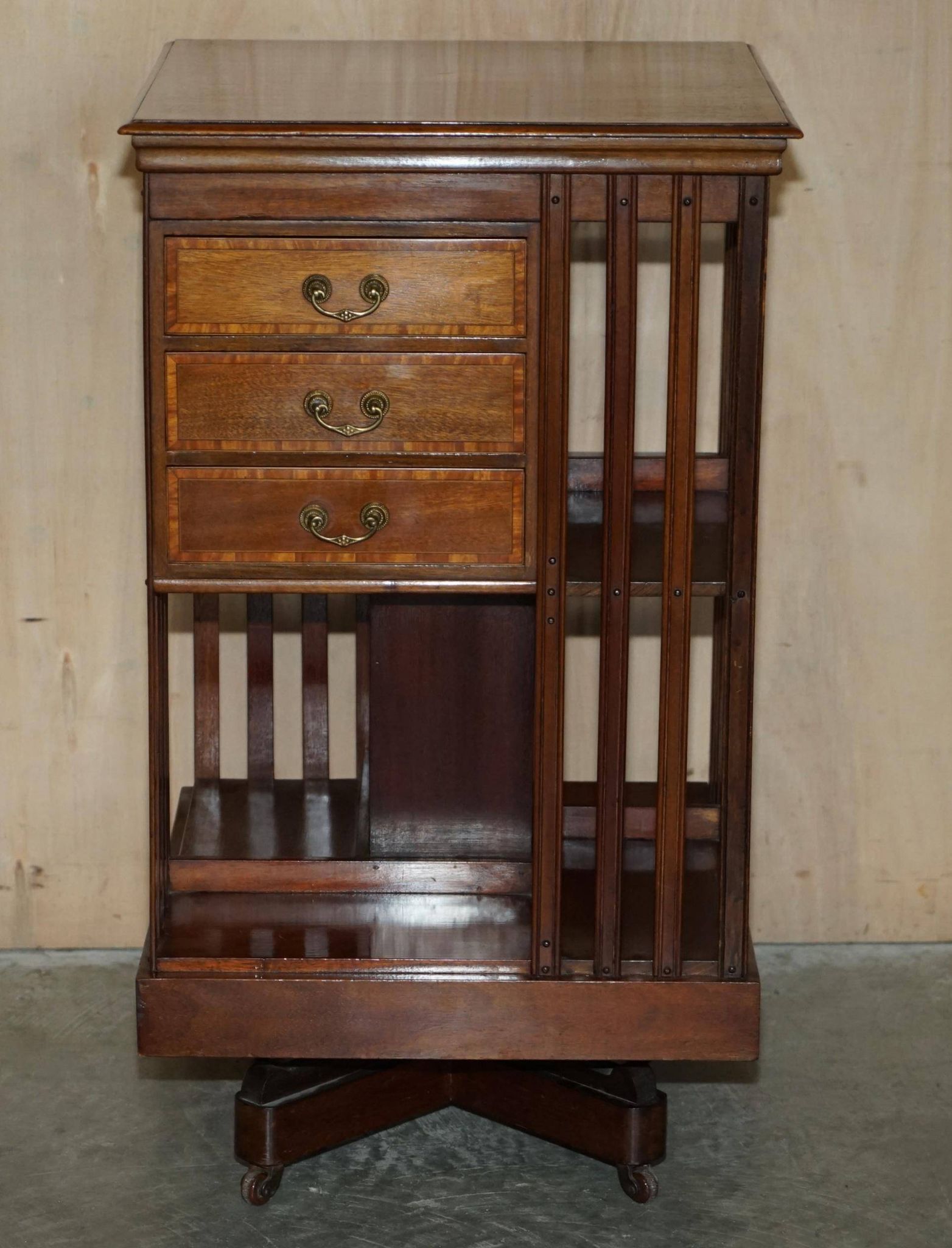 Restored Victorian walnut revolving library.