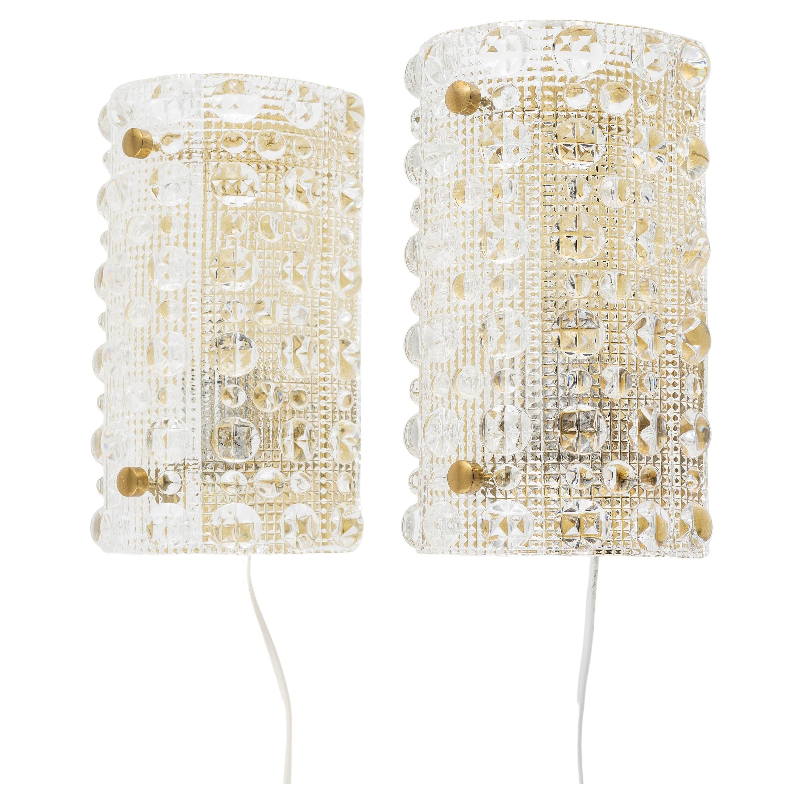 Carl Fagerlund, pair of glass wall lights for Lyfa, Orrefors Sweden, 1960.