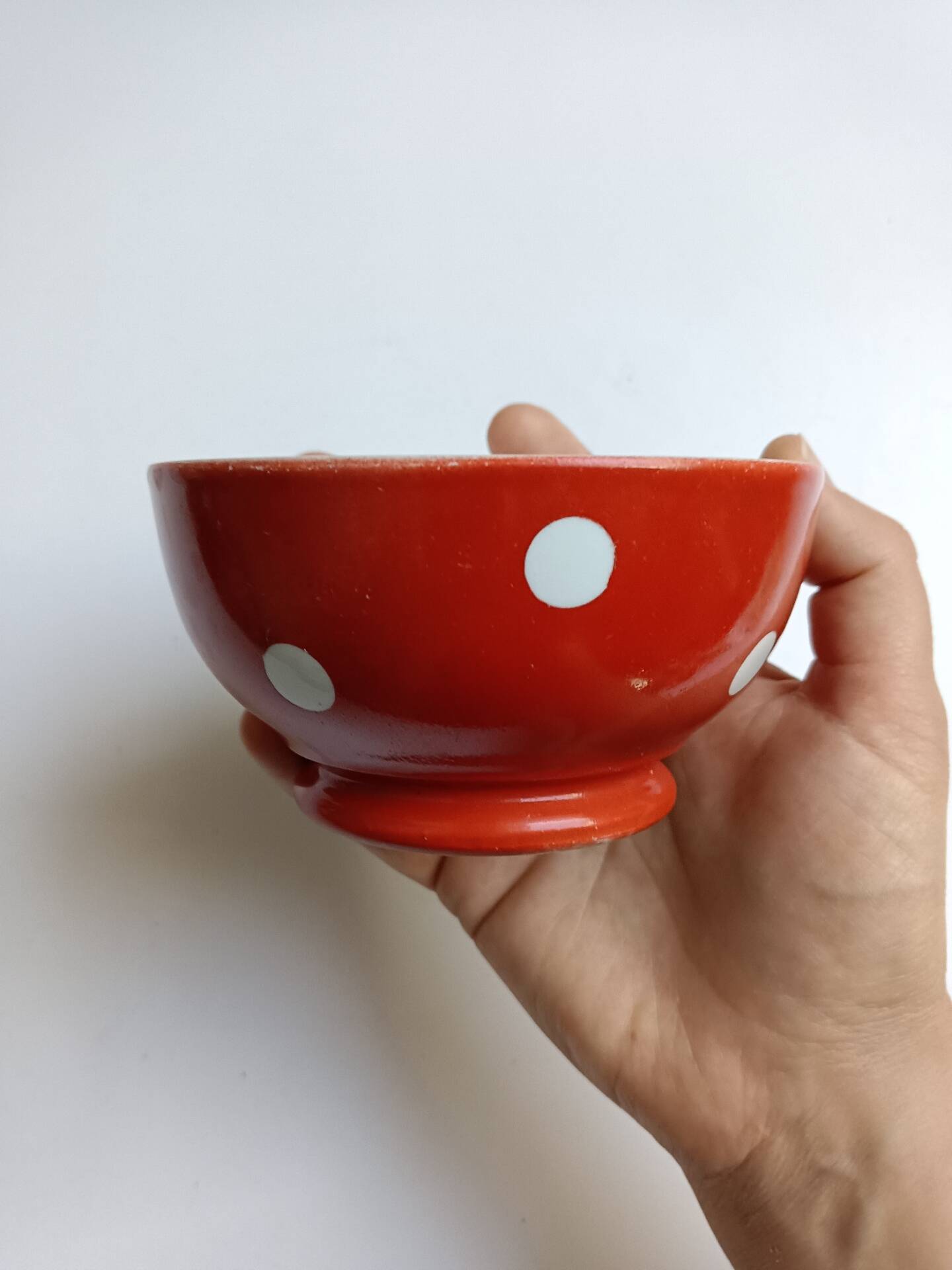 Red bowl with white polka dots in Longchamp ceramic