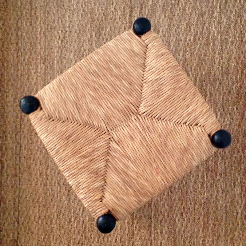 Straw and black stool