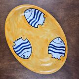 Oval dish decorated with hand-painted blue fish, Mediterranean style