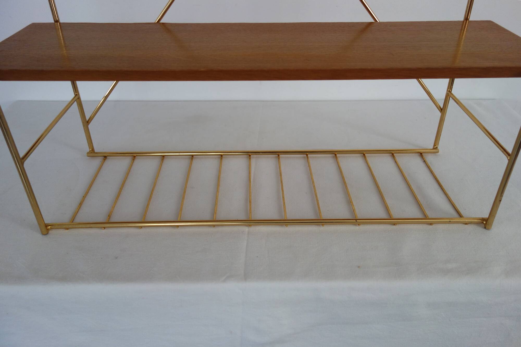 String wall shelf in gold metal and wood from the 60s