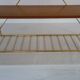 String wall shelf in gold metal and wood from the 60s