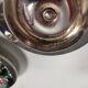 Silver-plated candle holders with inlaid red and green enamel