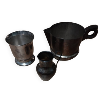 Set of two small pitchers and a silver timpani