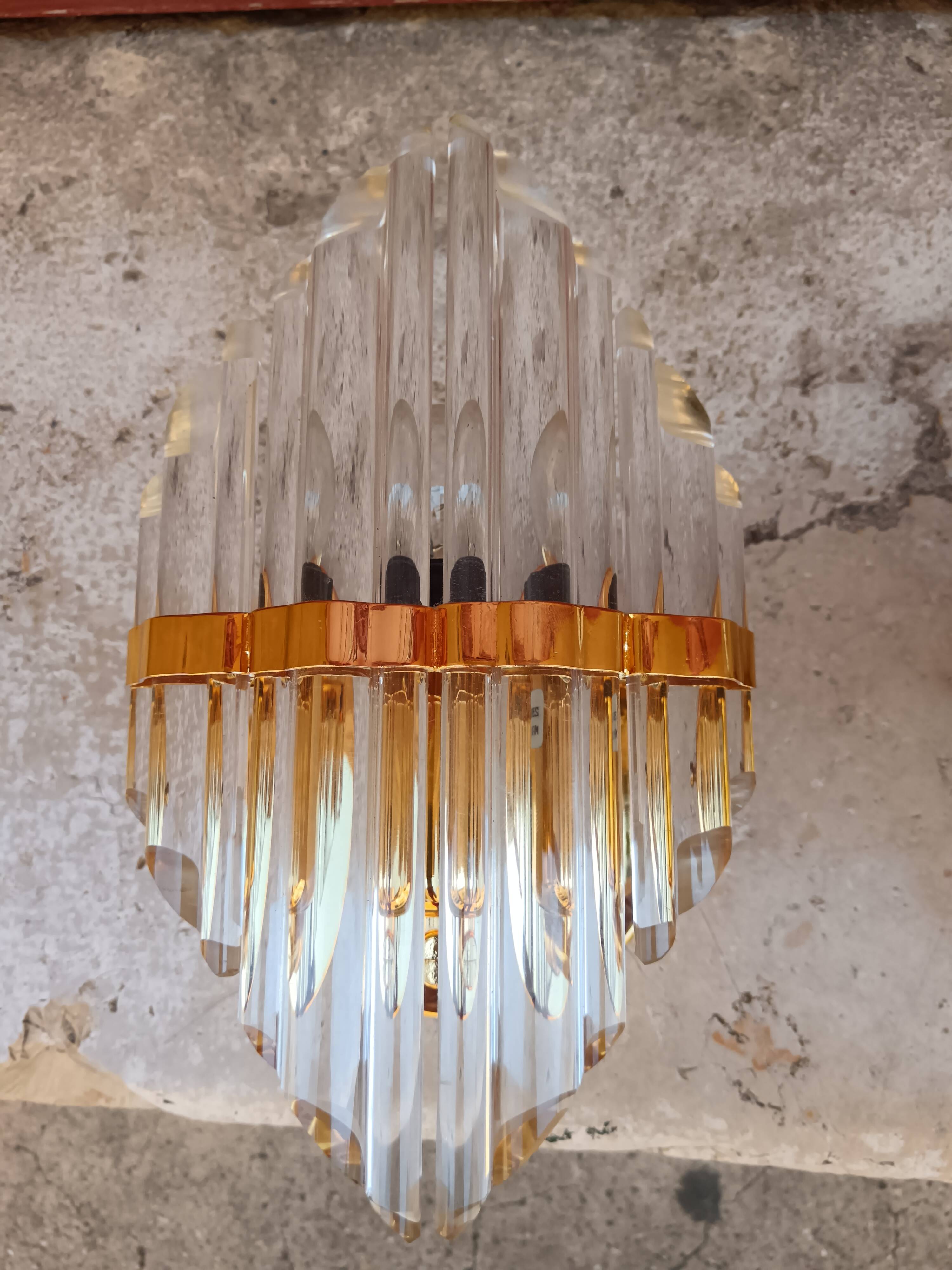 Pair of wall sconces in crystal glass and gilded brass. Venini style.
