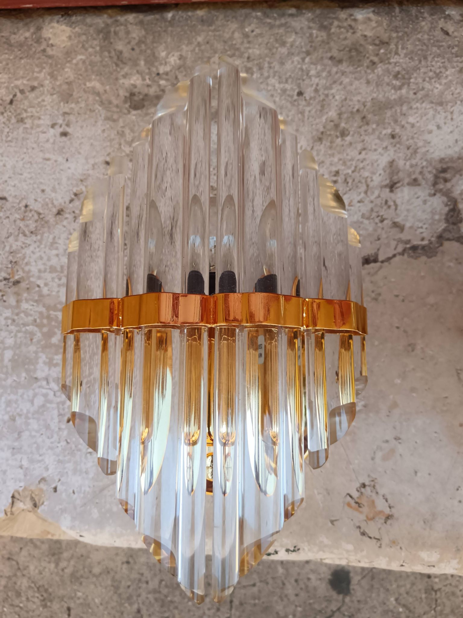 Pair of wall sconces in crystal glass and gilded brass. Venini style.
