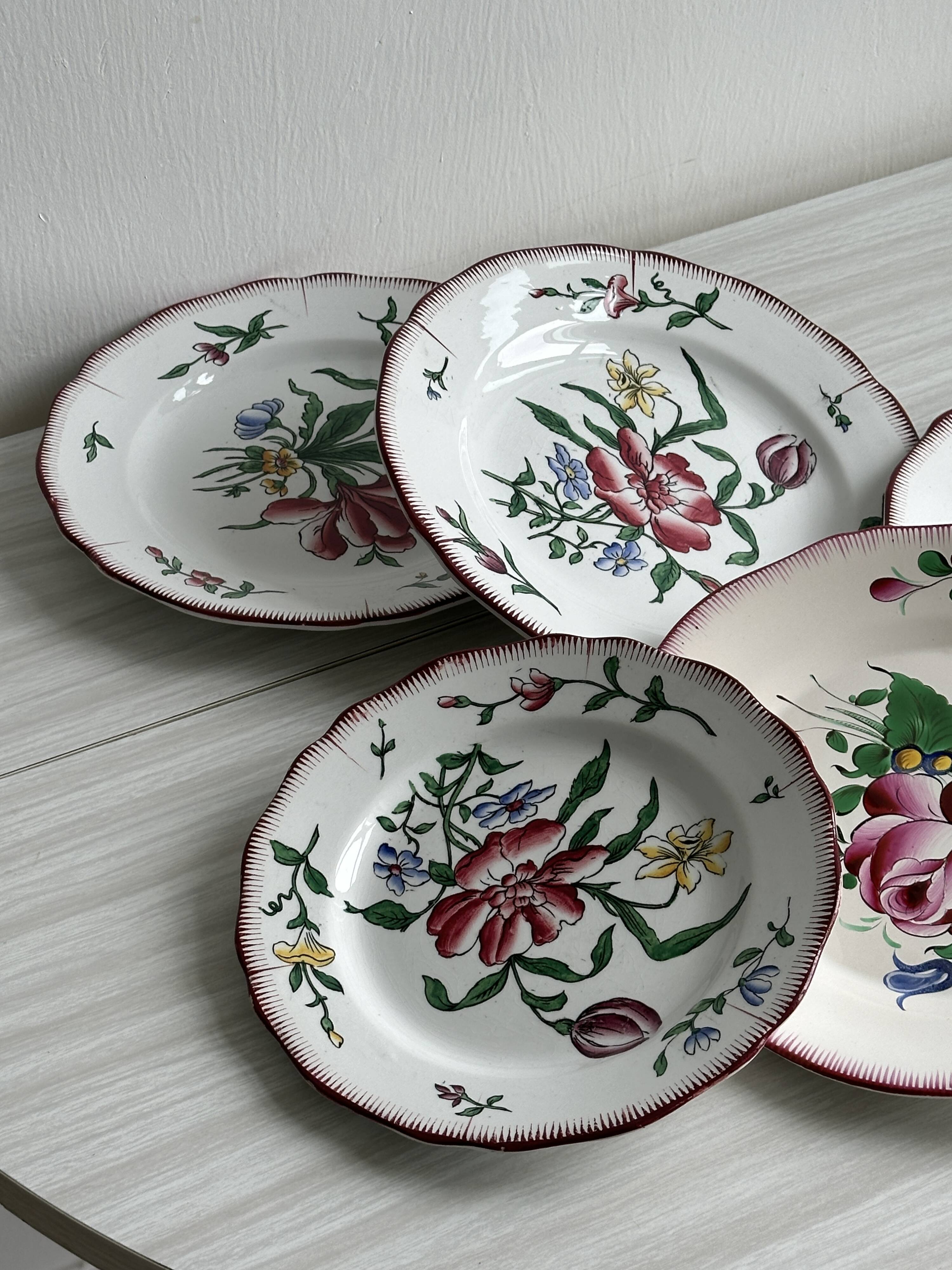5 plates with colorful Sarreguemines floral designs.